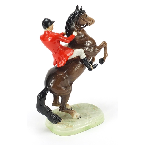 391 - Beswick huntsman on rearing horse, numbered 868, 24cm high