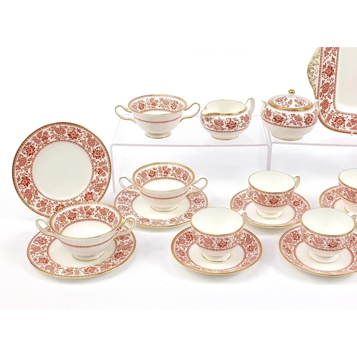 577 - Wedgwood Red Damask dinner and teaware including sandwich plate and trios, the largest 27cm wide