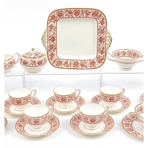 577 - Wedgwood Red Damask dinner and teaware including sandwich plate and trios, the largest 27cm wide