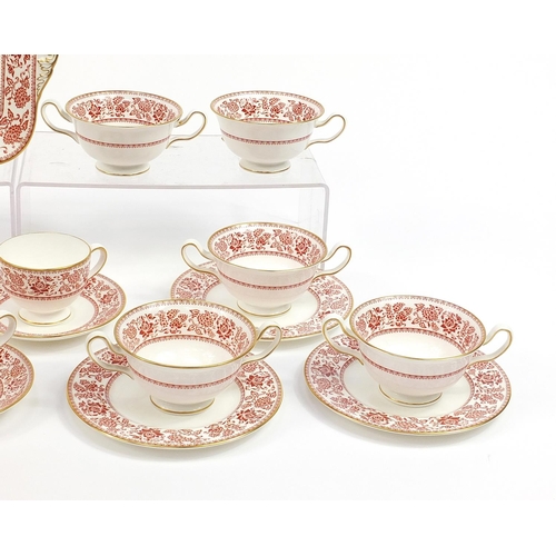 577 - Wedgwood Red Damask dinner and teaware including sandwich plate and trios, the largest 27cm wide