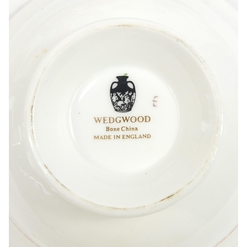 577 - Wedgwood Red Damask dinner and teaware including sandwich plate and trios, the largest 27cm wide