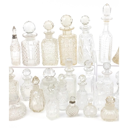 53 - Large collection of Victorian and later cut glass scent bottles and jars including seven with silver... 