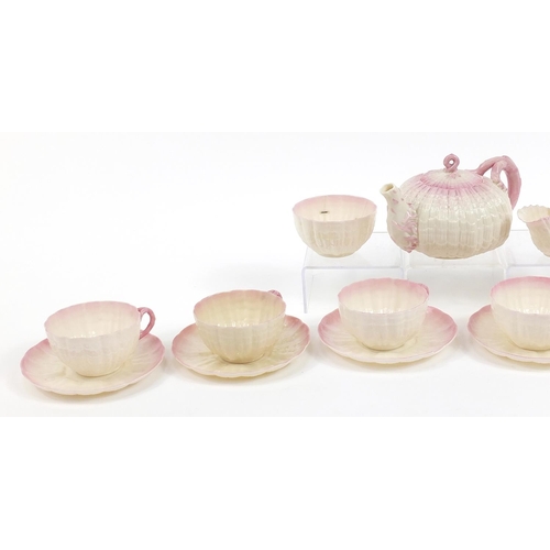 81 - Belleek, Irish porcelain shell design six place tea service comprising teapot, six cups with saucers... 