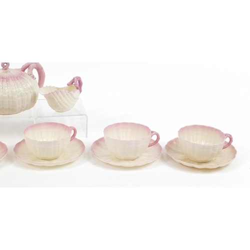 81 - Belleek, Irish porcelain shell design six place tea service comprising teapot, six cups with saucers... 