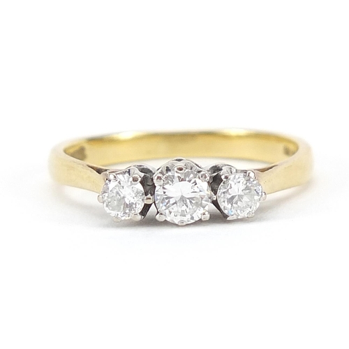 640 - 18ct gold three stone ring, size J/K, 2.8g