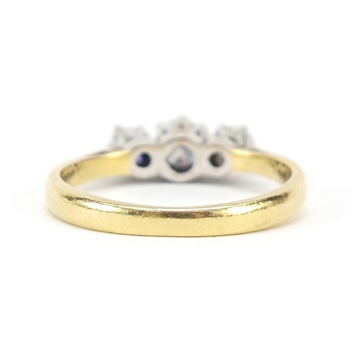 640 - 18ct gold three stone ring, size J/K, 2.8g