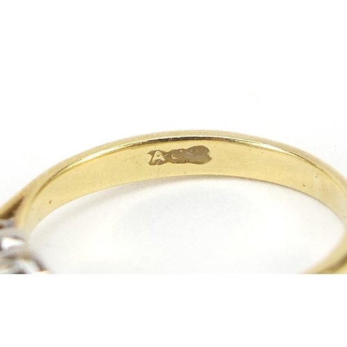 640 - 18ct gold three stone ring, size J/K, 2.8g