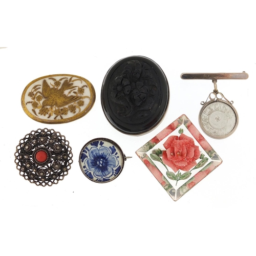 927 - Antique and later jewellery including a jet style brooch and a filigree metal brooch set with caboch... 