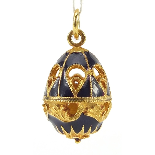 928 - Russian gilt metal and enamel egg pendant with box, 2.8cm high, 6.8g