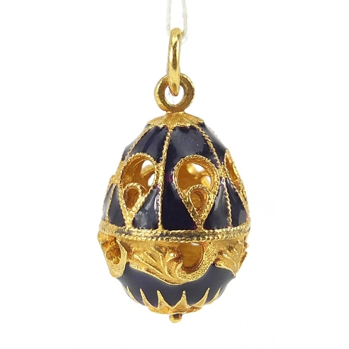 928 - Russian gilt metal and enamel egg pendant with box, 2.8cm high, 6.8g