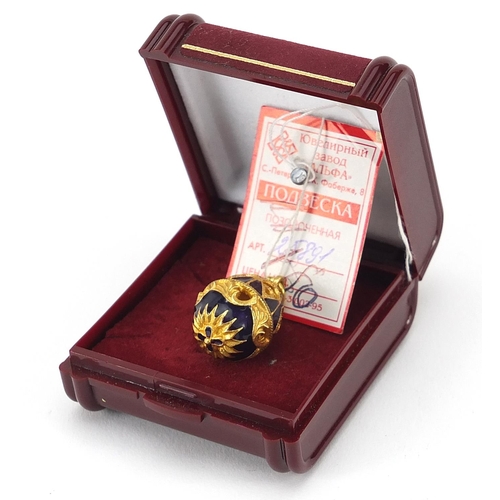 928 - Russian gilt metal and enamel egg pendant with box, 2.8cm high, 6.8g