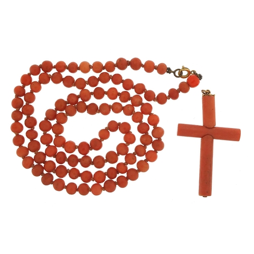 929 - Antique coral bead necklace and cross pendant, 60cm in length and 4.5cm high, 29.4g