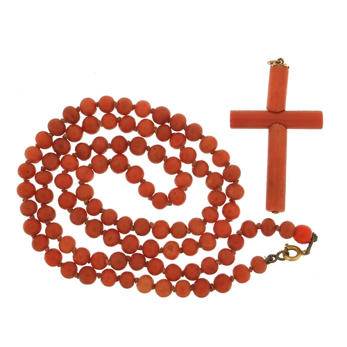 929 - Antique coral bead necklace and cross pendant, 60cm in length and 4.5cm high, 29.4g