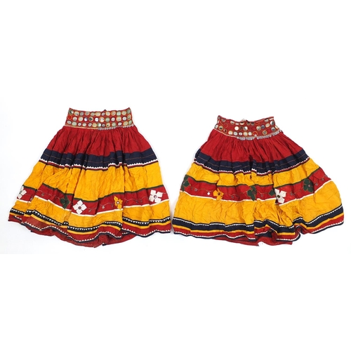 174 - Two Middle Eastern or Indian mirrored embroidered skirts, possibly Banjara tribe, each 83cm high