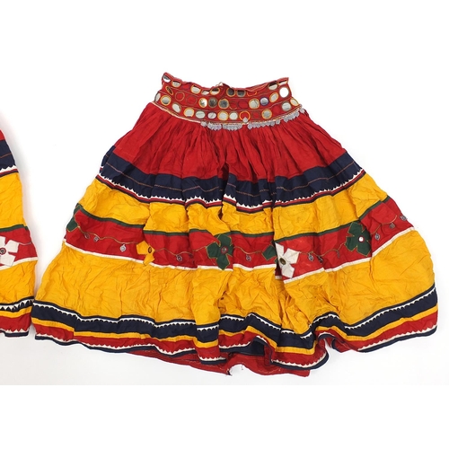 174 - Two Middle Eastern or Indian mirrored embroidered skirts, possibly Banjara tribe, each 83cm high