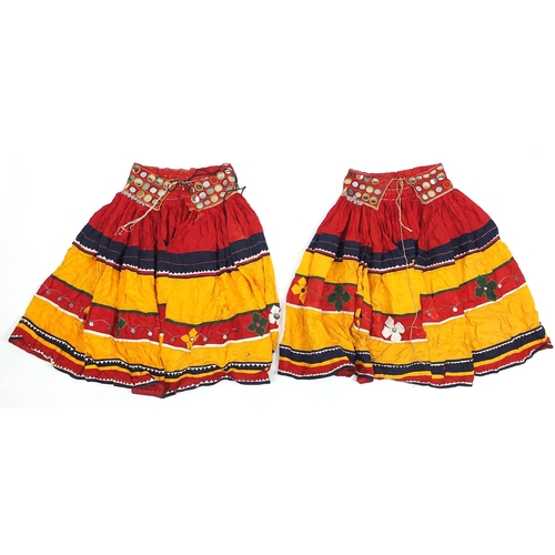 174 - Two Middle Eastern or Indian mirrored embroidered skirts, possibly Banjara tribe, each 83cm high