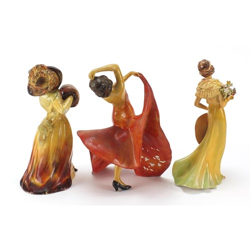 202 - Three Wade cellulose figurines of Art Deco females, the largest 24cm high