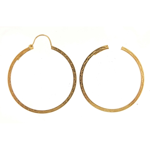 961 - Pair of 9ct gold Gypsy hoop earrings with engraved decoration, 3.5cm in diameter, 2.5g