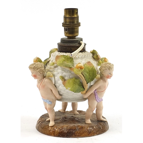 347 - Plaue Putti design porcelain lamp, impressed marks to the base, 22cm high