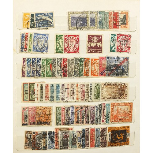 1970 - World stamps arranged in albums and on sheets including Mexico and Great Britain