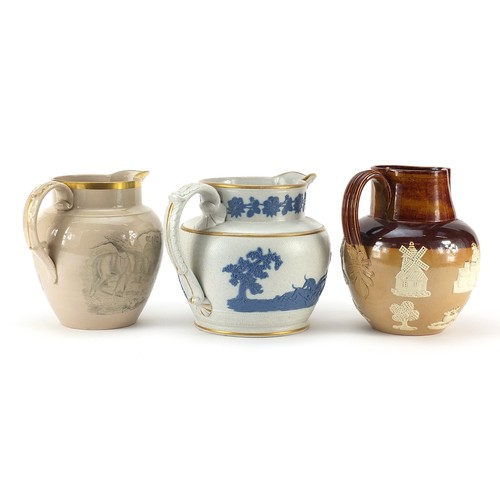 83 - Three 19th century and later hunting interest jugs including an example with applied sprigging, the ... 