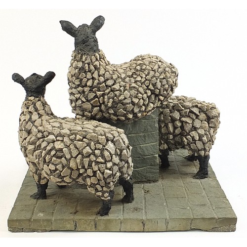 195 - Edward 'Ted' Roocroft - Three sheep and stone plinth, large concrete moquette, 46cm high x 51cm wide