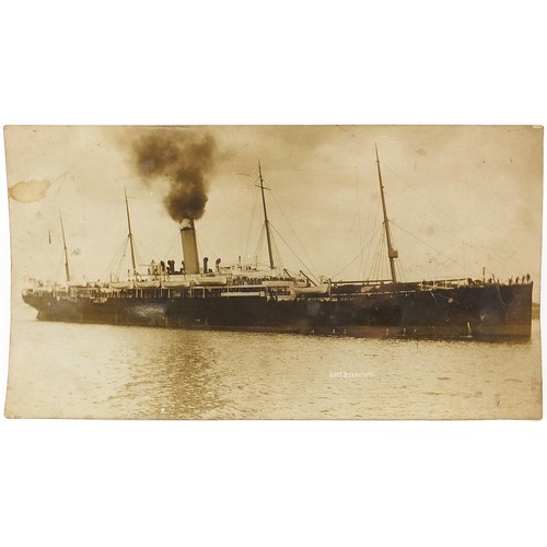 469 - Large black and white photographic postcard of HMT Derbyshire, 25.5cm x 14cm