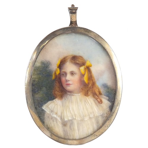 285 - Two Edwardian oval portrait miniatures of females, housed in pendant mounts, one unmarked silver, ea... 