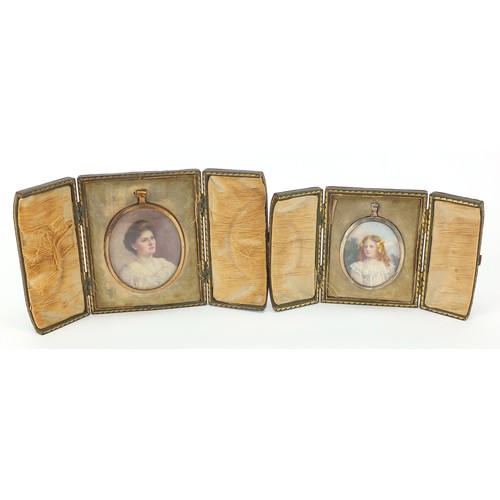 285 - Two Edwardian oval portrait miniatures of females, housed in pendant mounts, one unmarked silver, ea... 