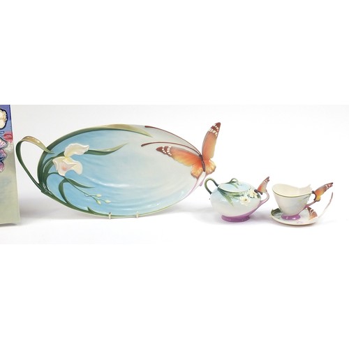 388 - Franz porcelain and a Moorcroft style plaque, some with boxes including butterfly cup and saucer, bu... 