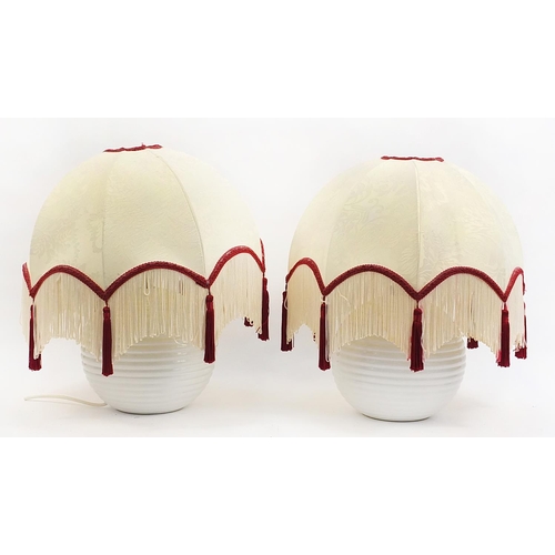 3 - Pair of white globular pottery table lamps with silk tasselled shades, 50cm high with shades
