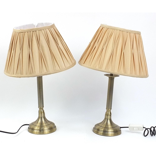 54 - Pair of Dunelm brass coloured metal table lamps with fabric shades, each 50cm high