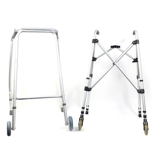 295 - Two metal mobility aids, one foldable, each with wheels, each 89cm high