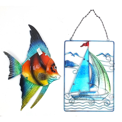 26 - Stylish colourful glass fish metal wall hanging and a similar sailing boat metal wall hanging, the l... 