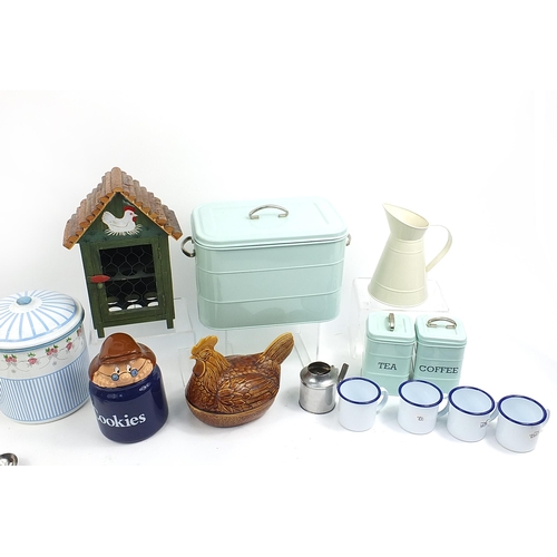 51 - Quantity of kitchenalia including enamel bread bin, matching jug, wooden chicken egg stand, pottery ... 