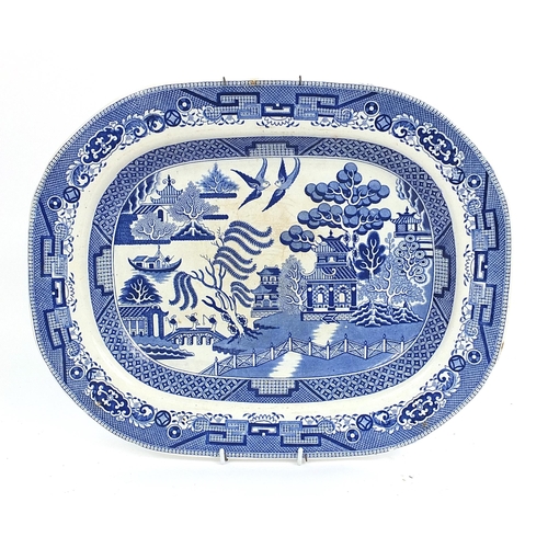 65 - Large Victorian C P & Co blue and white willow pattern pottery meat plate, 44cm x 35cm