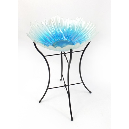 36 - Glass flower top table on a black metal stand, 54cm H x 40cm in diameter