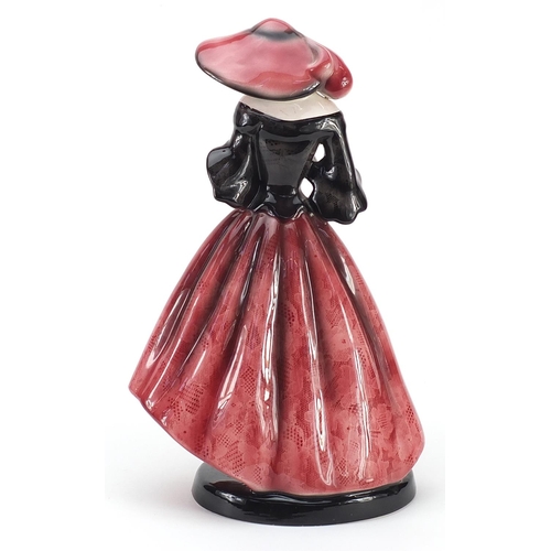 154 - Goldschneider, Czechoslovakian Art Deco pottery figurine of a female wearing a floral dress, numbere... 