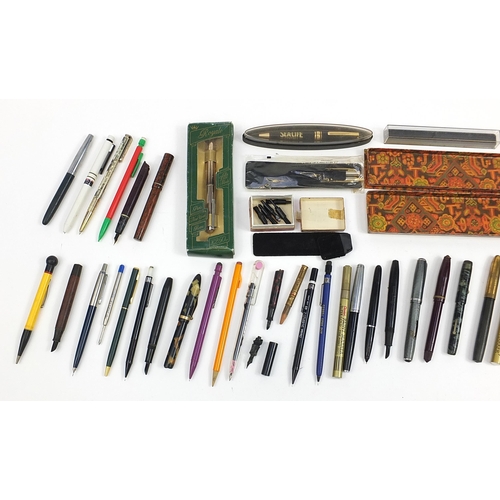 73 - Collection of vintage fountain and ballpoint pens and accessories including Watermans, brown ripple,... 