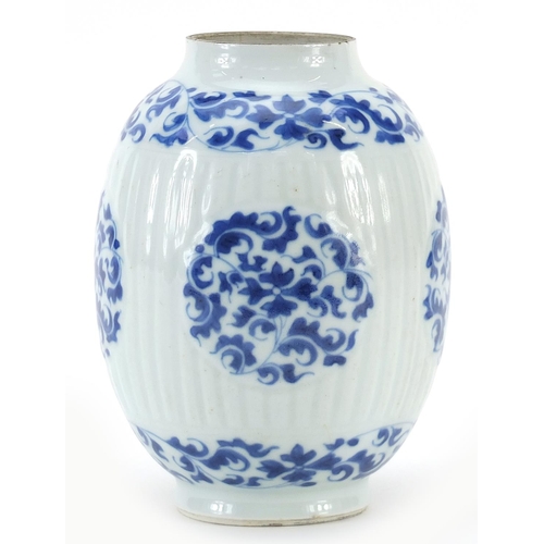37 - Chinese blue and white porcelain ribbed vase hand painted with flowers and scrolling foliage, Kangxi... 