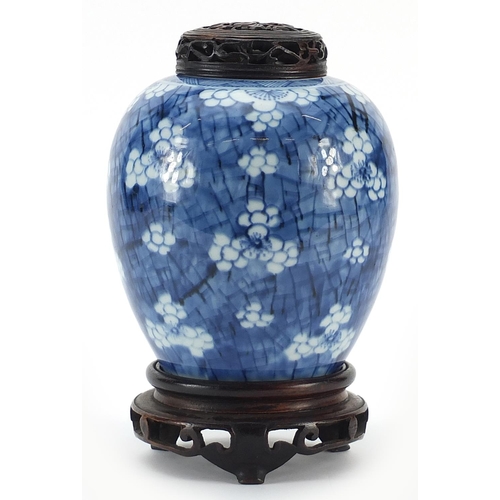 1 - Chinese blue and white porcelain ginger jar hand painted with prunus flowers on carved hardwood stan... 