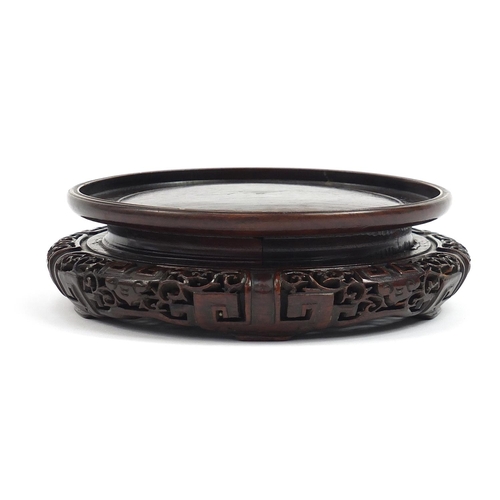 179 - Chinese carved hardwood stand, possibly Hongmu, inscribed paper label to the base, 18cm in diameter