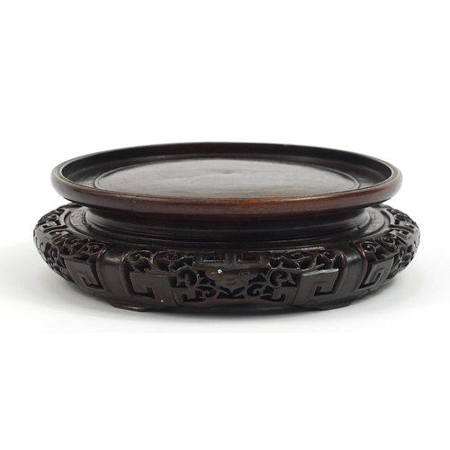 179 - Chinese carved hardwood stand, possibly Hongmu, inscribed paper label to the base, 18cm in diameter