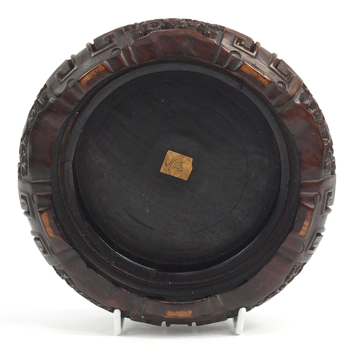 179 - Chinese carved hardwood stand, possibly Hongmu, inscribed paper label to the base, 18cm in diameter