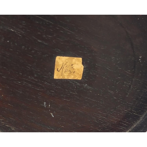 179 - Chinese carved hardwood stand, possibly Hongmu, inscribed paper label to the base, 18cm in diameter