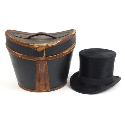23 - Early 20th century J T Ogdens top hat with leather case, the interior of the hat 19.5cm x 15.5cm