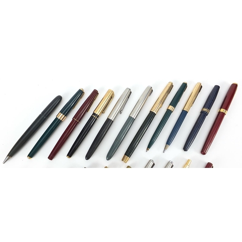 63 - Vintage and later fountain pens, ballpoint pens and two silver propelling pencils, including Parker ... 