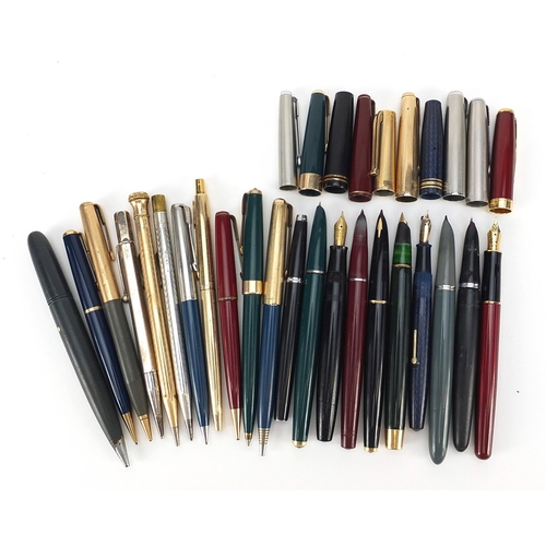 63 - Vintage and later fountain pens, ballpoint pens and two silver propelling pencils, including Parker ... 