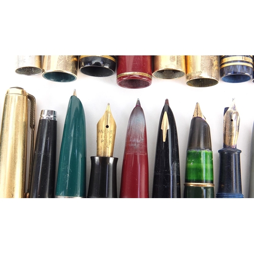 63 - Vintage and later fountain pens, ballpoint pens and two silver propelling pencils, including Parker ... 