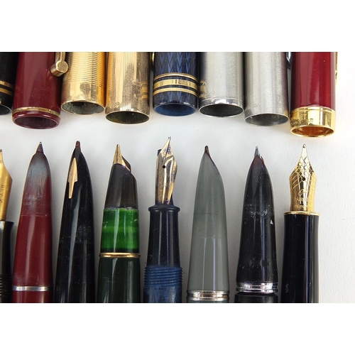 63 - Vintage and later fountain pens, ballpoint pens and two silver propelling pencils, including Parker ... 